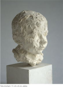 Tête d’enfant, 11 x 8 x 8 cm, plâtre